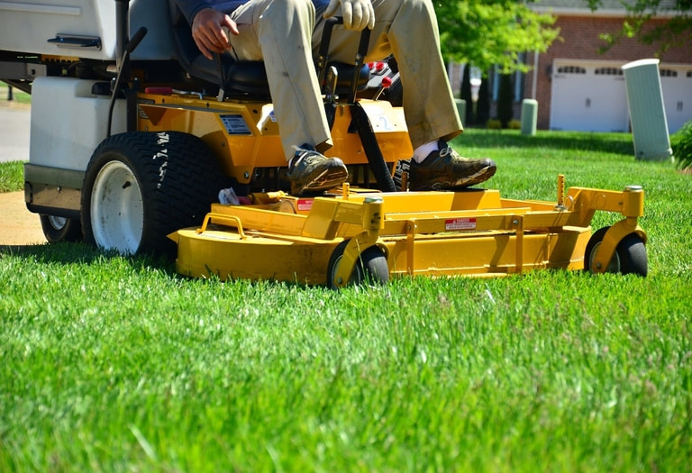 Mowing the yard with a commercial grade mower results in quicker, better results.